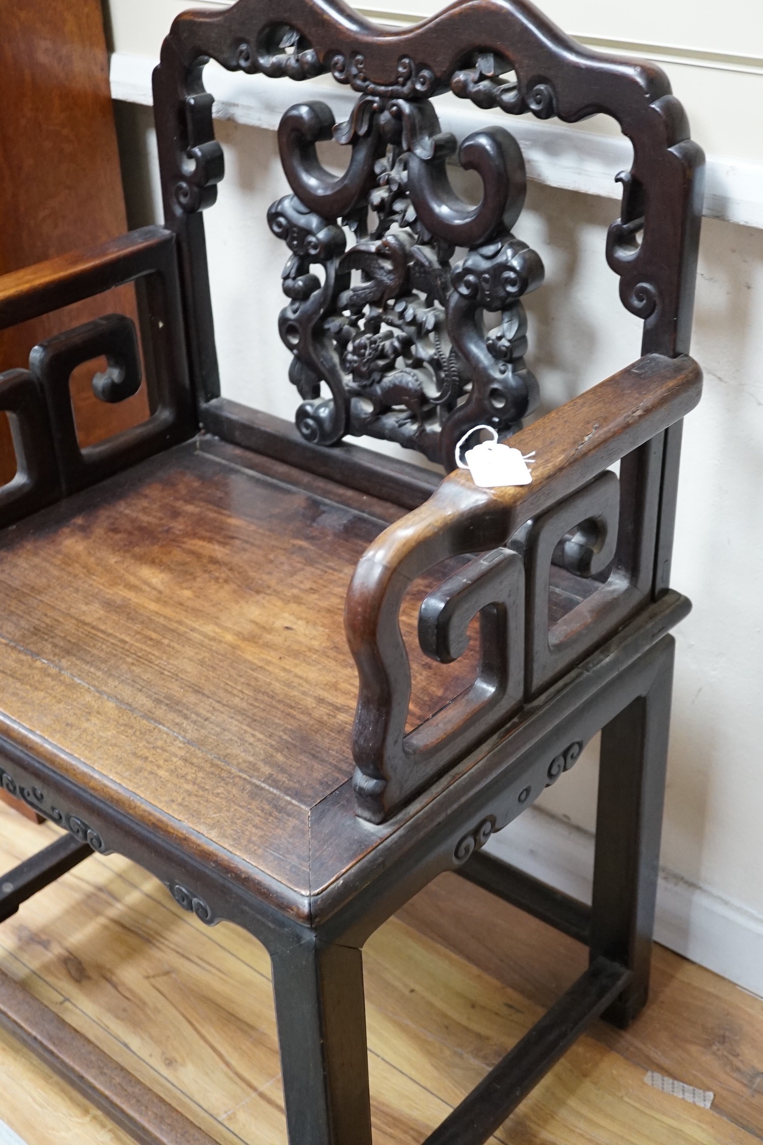 A 19th century Chinese hongmu armchair, width 64cm *Please note the sale commences at 9am.